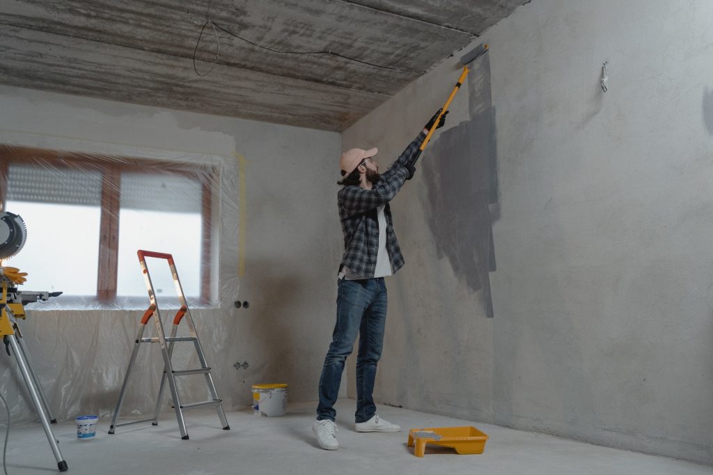 Man painting the room