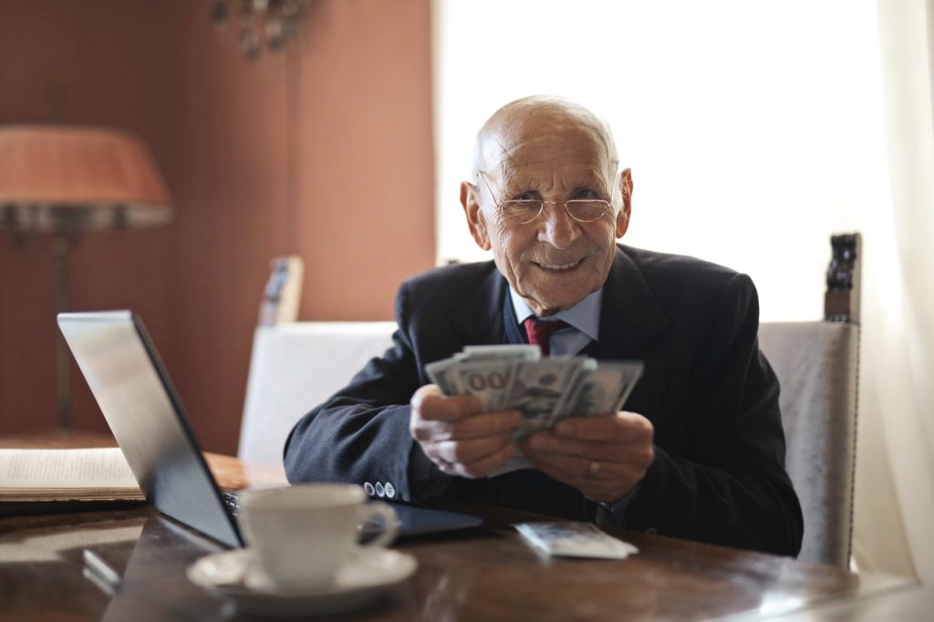 Old man holding money